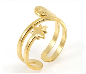 Close-up of adjustable 18k gold plated stainless steel ring with star and sunburst motifs