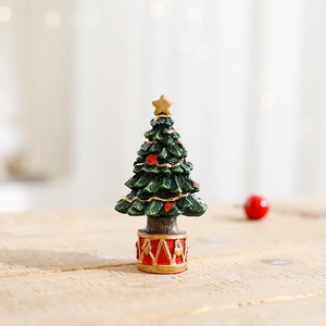 Miniature resin Christmas tree tabletop ornament with festive red and green hand-painted details