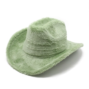Détail macro du chapeau de cowboy vert menthe en fausse fourrure texture peluche