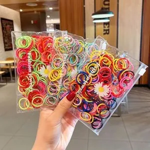 Close-up of colorful elastic hair bands in daisy printed zipper bags for little girls