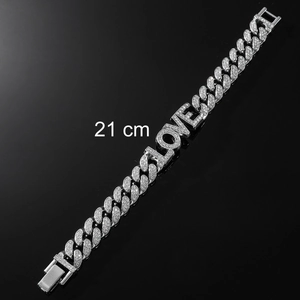 Detail of 21cm iced-out silver Cuban chain bracelet featuring LOVE letters and clasp