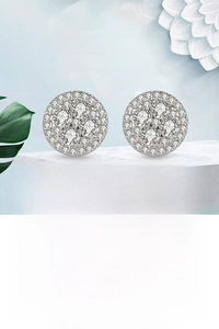 Macro shot of silver hip hop round stud earrings with pave-set micro zircon crystals