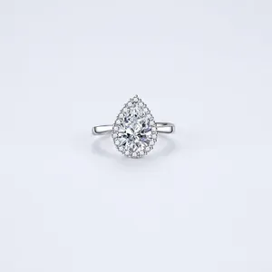 Elegant pear-cut green emerald ring with sparkling pave stones in white copper finish