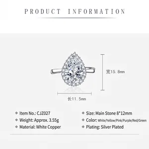 Elegant pear-cut green emerald ring with sparkling pave stones in white copper finish