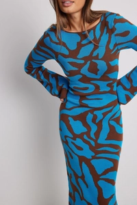 Detailed knit texture of abstract leopard print dress with brown and blue patterns