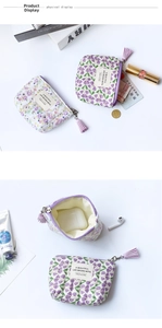 Macro detail of floral pouch interior with zipper and tulip pattern fabric storage