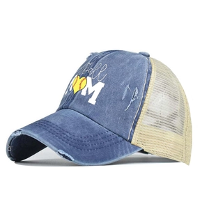 Washed blue and beige Softball Mom trucker hat with distressed denim and ponytail hole