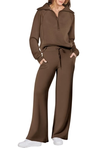 Detail of dark brown tracksuit with half-zip sweatshirt and wide-leg drawstring pants