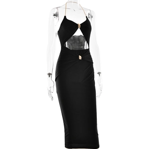 Detail of black halter dress featuring hollow-out waist design and gold chain link buckle
