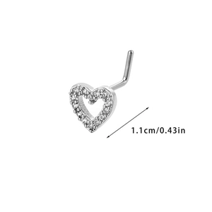 Detail shot of a silver heart nose stud featuring white zircon and L-shaped post design