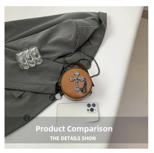 Mini round brown leather bag with silver cross decoration and metal chain strap details