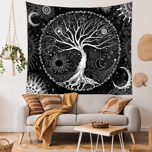 Detail of life tree tapestry on white wall above sofa in bohemian living room