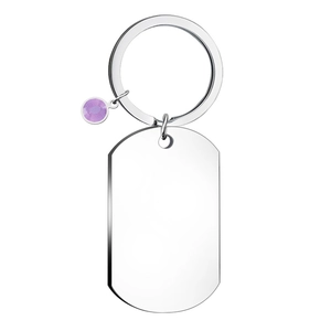 Detail of silver stainless steel dog tag keychain with a faceted purple gemstone charm
