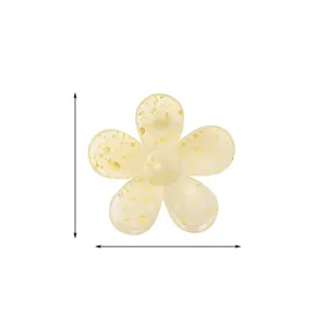 Detail view of yellow translucent flower hair claw clip with gold glitter, size 7cm x 7.5cm