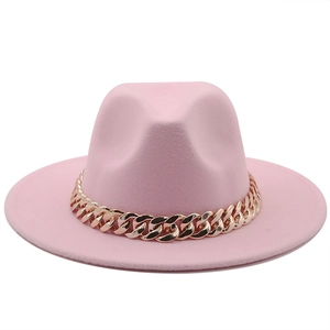 Detailed close-up of pink wool fedora hat with elegant gold Cuban chain accessory
