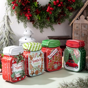Set of four Christmas tinplate boxes with Santa, gingerbread, and holiday carols designs