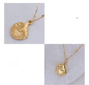 Macro view of fishtail embossed pendant in 18K gold plated surgical titanium steel