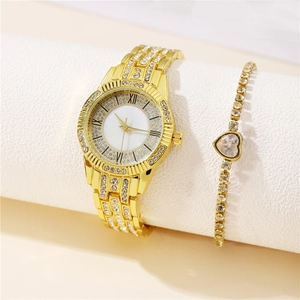Elegant gold watch set with diamond accents and matching heart-shaped crystal bracelet
