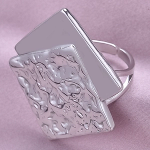 Macro shot of silver dual-layer 304 stainless steel ring with hammered texture detail