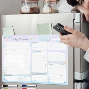 Detailed magnetic acrylic daily planner board with cloud design on a fridge