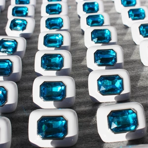 White enamel rectangle stud earrings with sky blue square zircon stones in a row