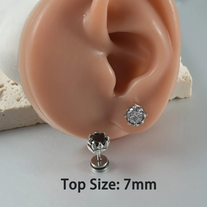 Detailed macro view of 7mm cubic zirconia stud earrings with stainless steel claw setting