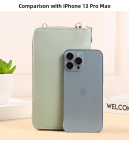 Detailed size comparison of the mint green touchscreen phone bag with iPhone 13 Pro Max