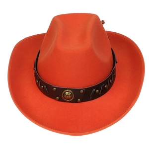 Detail of orange wool felt western cowboy hat with studded leather band and gold horseshoe