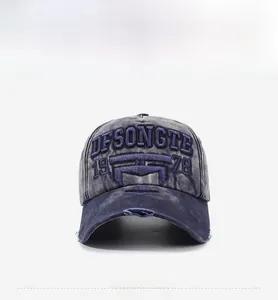 Detail view of vintage washed cotton baseball cap with 3D embroidery and distressed brim