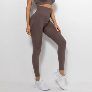 Detail of high-waisted seamless yoga pants in cocoa brown with breathable mesh texture