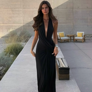 Detail of elegant black deep V-neck halter dress with flattering ruched waist design