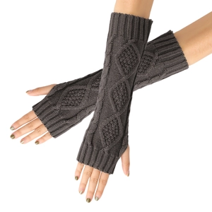 Detail of dark brown cable knit fingerless gloves with diamond patterns for winter warmth