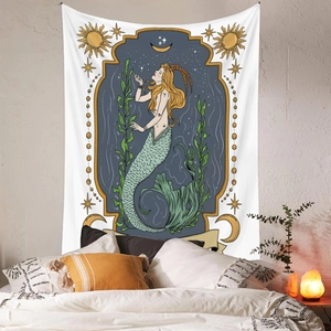 Detail of bohemian Capricorn mermaid tapestry on bedroom wall with warm light scene