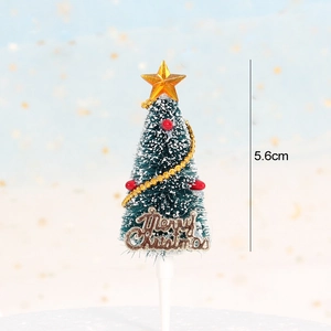 Detailed view of a 5.6cm green flocked Christmas tree cake topper with Merry Christmas sign