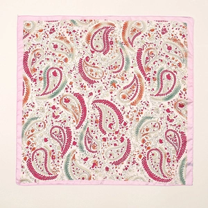 Detail of square silk scarf with paisley print and fine pink stitched border edges