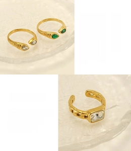 Macro detail of snake texture rings with zircon stones and 18K gold plated finish