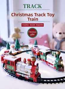 Macro view of vintage Christmas train toy with steam engine and festive decorations