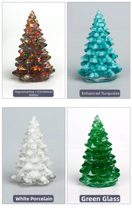 Detail view of four resin Christmas trees in aquamarine, turquoise, porcelain, and green glaze