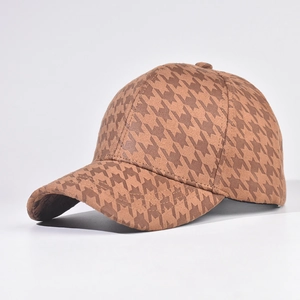 Detailed side view of houndstooth baseball cap in brown suede with structured curved brim