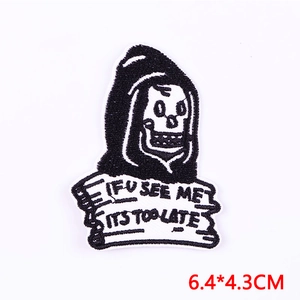Detail of embroidered Grim Reaper patch with 'IF U SEE ME IT'S TOO LATE' slogan text