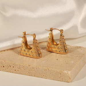 Minimalist gold plated titanium steel geometric bag-shaped earrings on stone surface