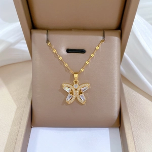 Luxurious gold butterfly necklace and earrings set with cubic zirconia stones