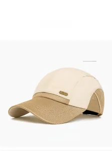 Detail of breathable beige mesh fabric and metal plaque on a quick-dry baseball cap