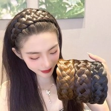 Close-up of thick braided hairband in multiple shades showing realistic synthetic fibers