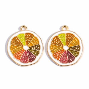 Detailed close-up of golden alloy citrus fruit pendants with colorful enamel inlay
