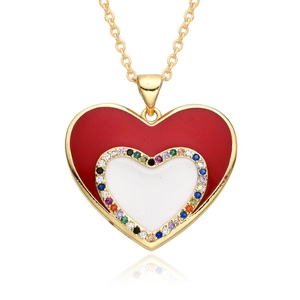Macro detail of heart pendant with colorful zircon stones and red white enamel coating