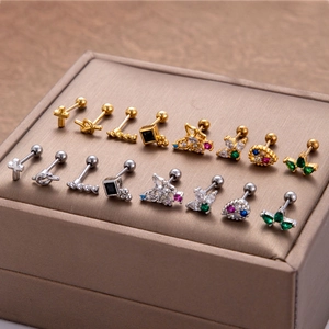 Surgical steel stud earrings set featuring zircon butterfly and cross designs in gold and silver