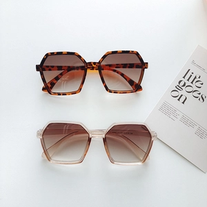 Detail view of KD97177 oversized hexagonal sunglasses in leopard and champagne frames