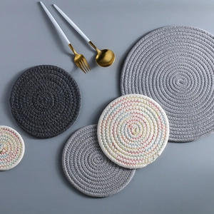 Japanese woven cotton rope table mats in grey and white with minimalist cutlery