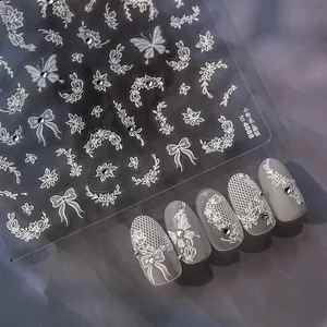 Minimalist white floral nail stickers with sparkling rhinestones and butterfly patterns